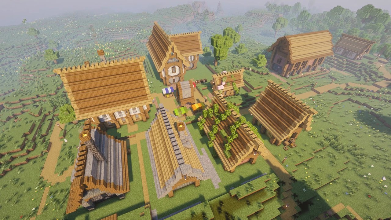 Flying over a TownTopia village: houses, fields and a market